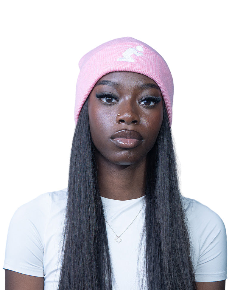Person wearing a pink beanie and white shirt on a white background